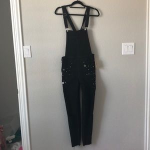 Black overalls with star embellishments